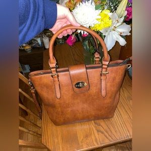 Light brown leather purse with gold hardware